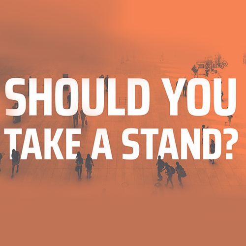 Aerial view of people walking with the text: Should you take a stand?