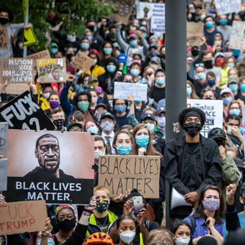 Protestors holding signs at Black Lives Matter march.