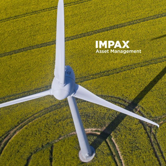 Aerial view of a windmill in a field