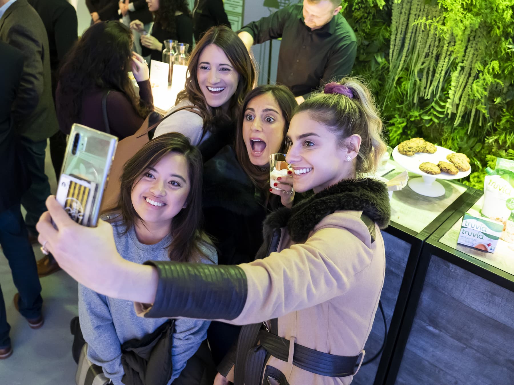 A group of women taking a selfie at a Truvia activation