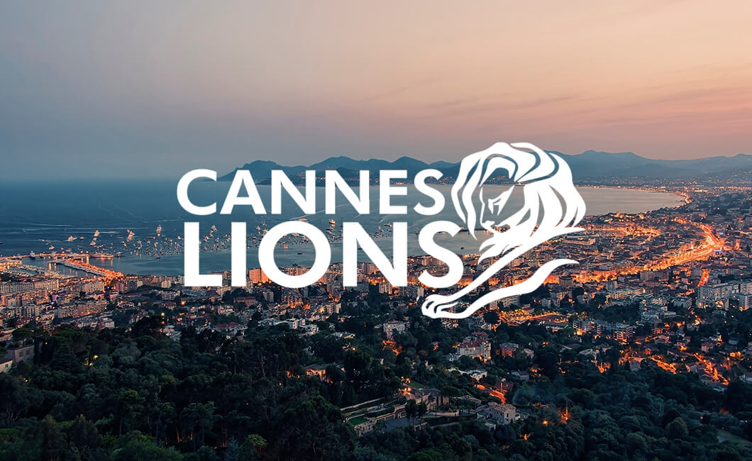 Logo for Cannes Lions overlayed on a view of the Cannes skyline.