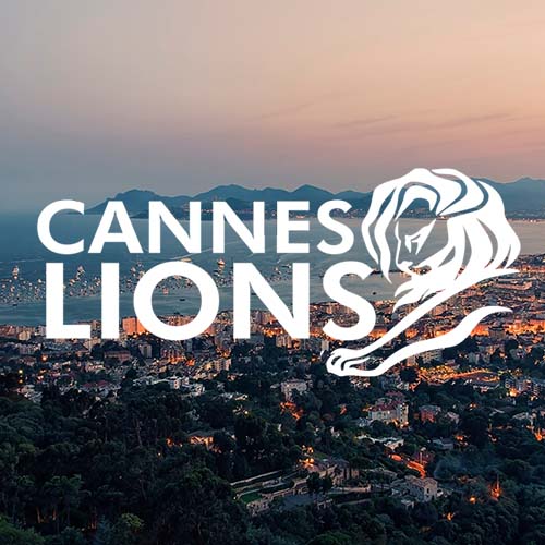 Logo for Cannes Lions overlayed on a view of the Cannes skyline.