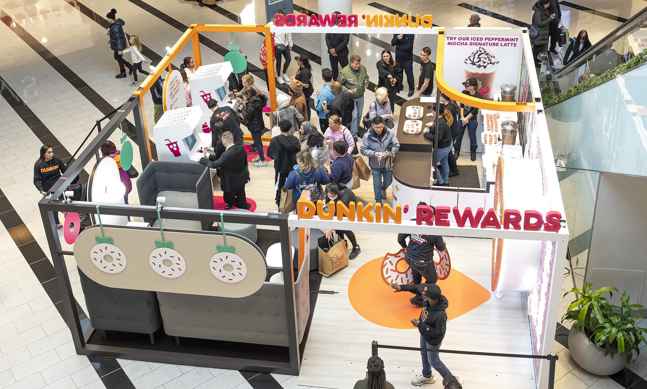 Overhead shot of Dunkin' Rewards Pop-Up Lounge activation bustling with visitors