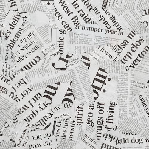 Newspaper clippings piled on top of each other