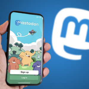 Mastodon app sign in page on a smartphone against a blue background