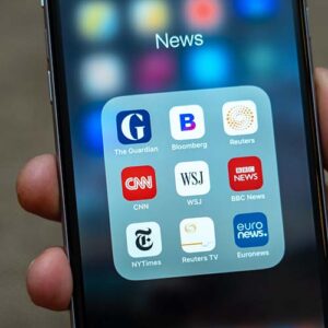 Folder on an iPhone with several news apps including the Guardia, CNN, New York Times, Wall Street Journal, and Bloomberg